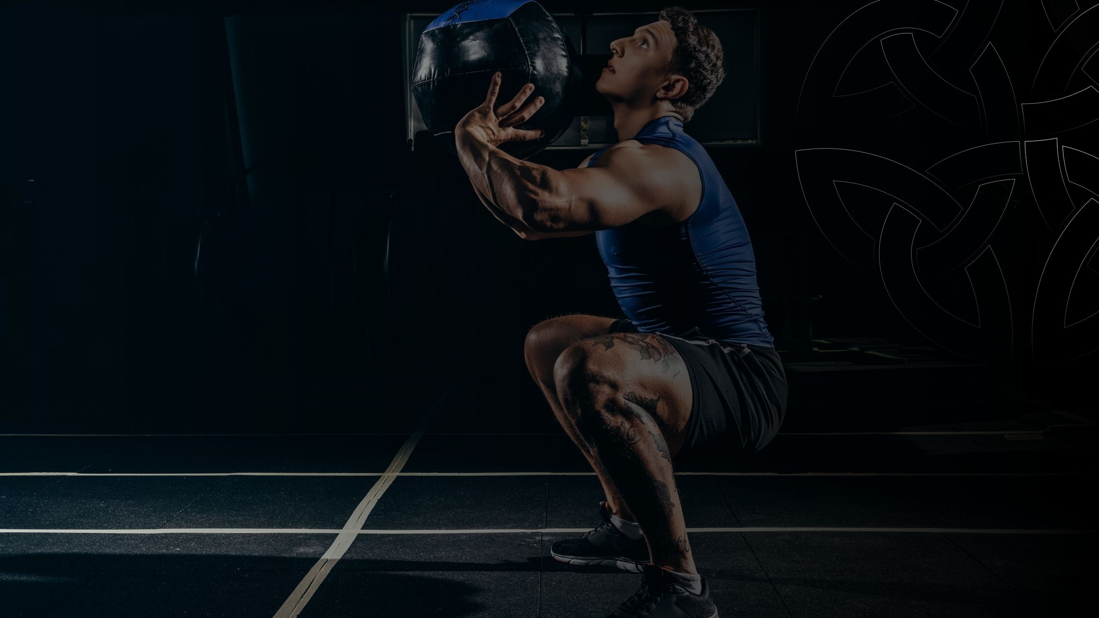 Athlete doing weight squats How Recovery Improves Consistency Across All Sports header